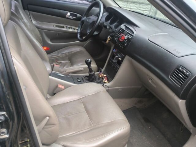 Черный Шевроле Эванда, объемом двигателя 2 л и пробегом 180 тыс. км за 3000 $, фото 2 на Automoto.ua