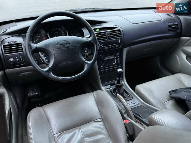 Чорний Шевроле Еванда, об'ємом двигуна 2 л та пробігом 303 тис. км за 2950 $, фото 7 на Automoto.ua