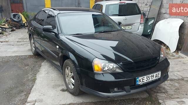 Черный Шевроле Эванда, объемом двигателя 2 л и пробегом 220 тыс. км за 4000 $, фото 2 на Automoto.ua