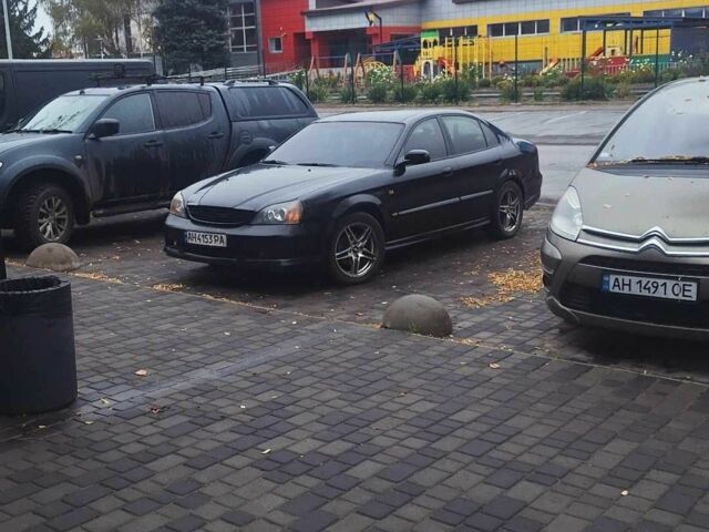 Черный Шевроле Эванда, объемом двигателя 2.5 л и пробегом 215 тыс. км за 3114 $, фото 14 на Automoto.ua