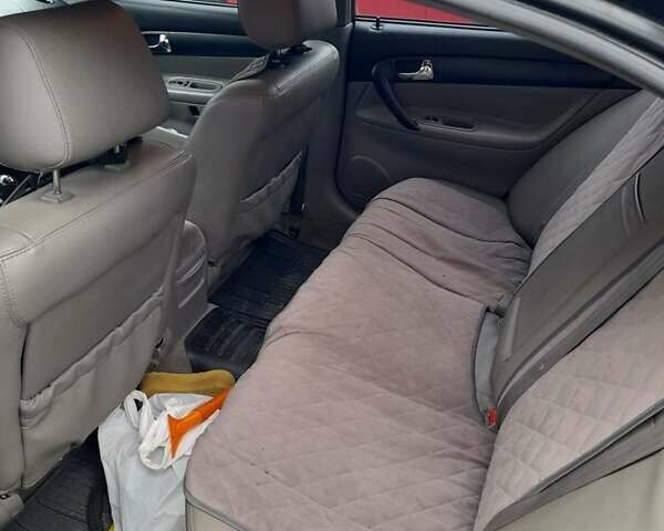 Черный Шевроле Эванда, объемом двигателя 2 л и пробегом 200 тыс. км за 3800 $, фото 4 на Automoto.ua