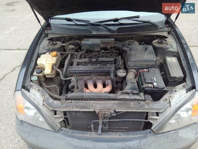 Черный Шевроле Эванда, объемом двигателя 2 л и пробегом 313 тыс. км за 3600 $, фото 3 на Automoto.ua