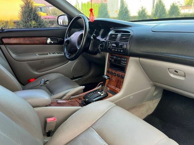 Черный Шевроле Эванда, объемом двигателя 2.5 л и пробегом 150 тыс. км за 3000 $, фото 1 на Automoto.ua