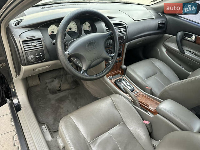 Черный Шевроле Эванда, объемом двигателя 2.5 л и пробегом 165 тыс. км за 3499 $, фото 9 на Automoto.ua