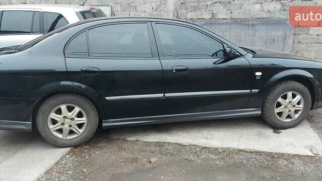 Черный Шевроле Эванда, объемом двигателя 2 л и пробегом 220 тыс. км за 4000 $, фото 4 на Automoto.ua