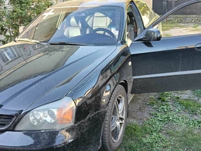 Черный Шевроле Эванда, объемом двигателя 2.5 л и пробегом 215 тыс. км за 3114 $, фото 11 на Automoto.ua