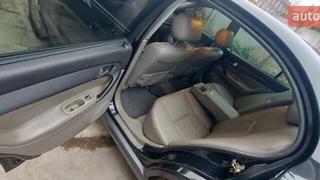 Черный Шевроле Эванда, объемом двигателя 2 л и пробегом 220 тыс. км за 4000 $, фото 13 на Automoto.ua