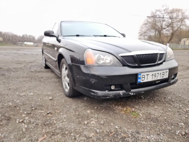 Черный Шевроле Эванда, объемом двигателя 2.5 л и пробегом 258 тыс. км за 4199 $, фото 6 на Automoto.ua