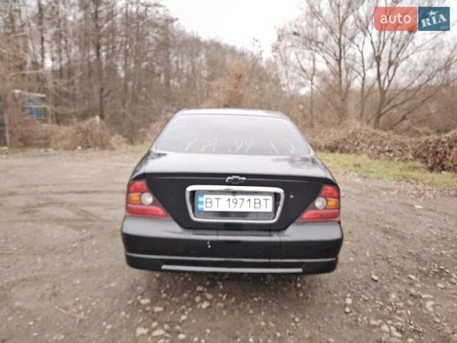 Черный Шевроле Эванда, объемом двигателя 2.5 л и пробегом 256 тыс. км за 4199 $, фото 4 на Automoto.ua