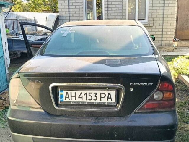 Черный Шевроле Эванда, объемом двигателя 2.5 л и пробегом 215 тыс. км за 3114 $, фото 1 на Automoto.ua