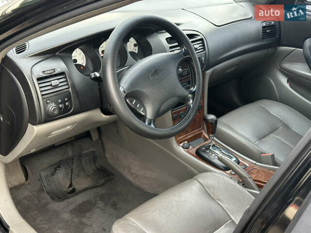 Черный Шевроле Эванда, объемом двигателя 2.5 л и пробегом 165 тыс. км за 3499 $, фото 11 на Automoto.ua