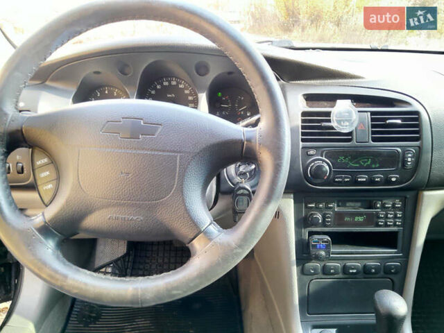 Черный Шевроле Эванда, объемом двигателя 2 л и пробегом 260 тыс. км за 4150 $, фото 1 на Automoto.ua