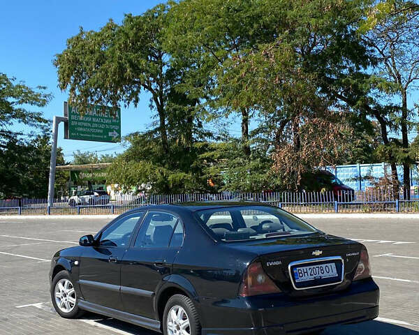 Черный Шевроле Эванда, объемом двигателя 2 л и пробегом 266 тыс. км за 3600 $, фото 1 на Automoto.ua