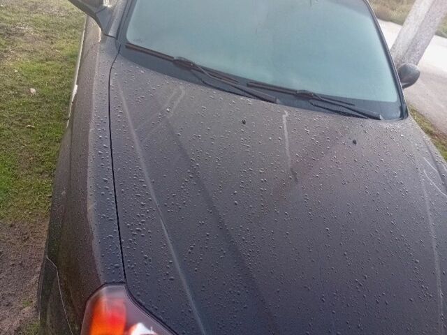 Черный Шевроле Эванда, объемом двигателя 2 л и пробегом 180 тыс. км за 5999 $, фото 1 на Automoto.ua