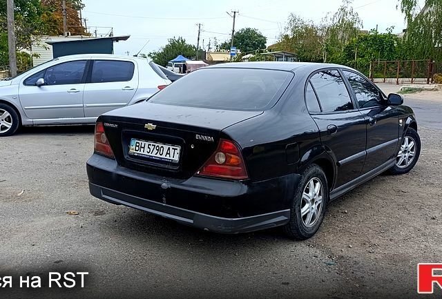 Черный Шевроле Эванда, объемом двигателя 2.5 л и пробегом 250 тыс. км за 2350 $, фото 3 на Automoto.ua