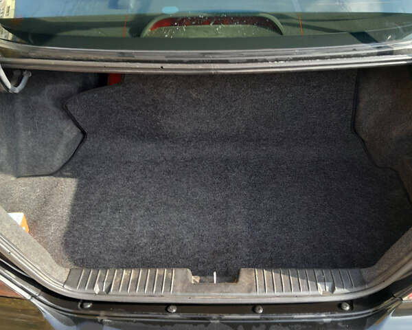 Черный Шевроле Эванда, объемом двигателя 2 л и пробегом 260 тыс. км за 4150 $, фото 3 на Automoto.ua