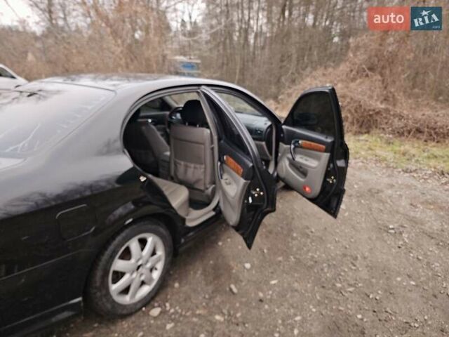 Черный Шевроле Эванда, объемом двигателя 2.5 л и пробегом 256 тыс. км за 4199 $, фото 9 на Automoto.ua