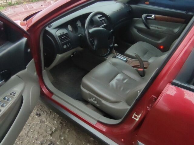 Красный Шевроле Эванда, объемом двигателя 2 л и пробегом 199 тыс. км за 4000 $, фото 4 на Automoto.ua