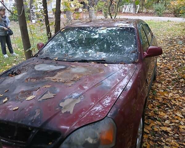 Красный Шевроле Эванда, объемом двигателя 2 л и пробегом 180 тыс. км за 1300 $, фото 7 на Automoto.ua