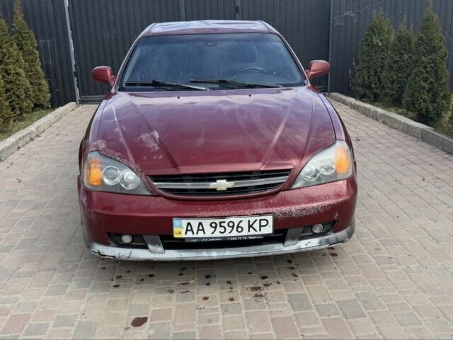 Красный Шевроле Эванда, объемом двигателя 2 л и пробегом 220 тыс. км за 1650 $, фото 5 на Automoto.ua