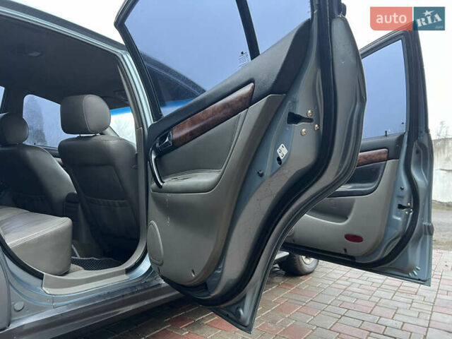 Сірий Шевроле Еванда, об'ємом двигуна 2 л та пробігом 255 тис. км за 2650 $, фото 5 на Automoto.ua