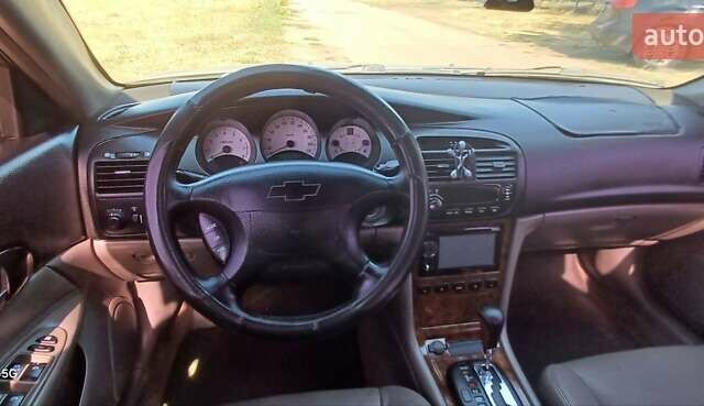 Серый Шевроле Эванда, объемом двигателя 2 л и пробегом 283 тыс. км за 2800 $, фото 3 на Automoto.ua