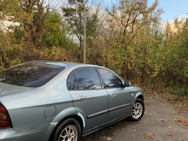 Серый Шевроле Эванда, объемом двигателя 2 л и пробегом 235 тыс. км за 2950 $, фото 2 на Automoto.ua