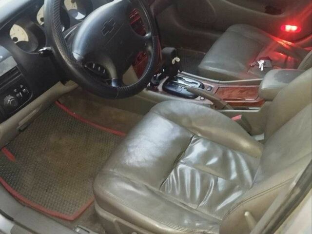 Серый Шевроле Эванда, объемом двигателя 2 л и пробегом 234 тыс. км за 2900 $, фото 2 на Automoto.ua