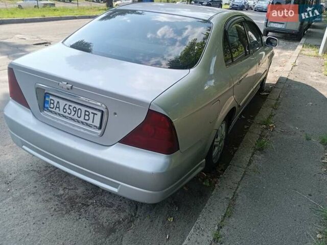 Серый Шевроле Эванда, объемом двигателя 2 л и пробегом 215 тыс. км за 2900 $, фото 26 на Automoto.ua