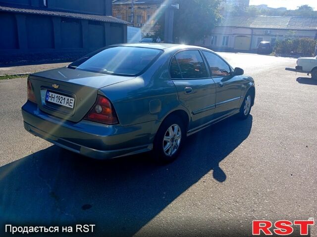 Серый Шевроле Эванда, объемом двигателя 2 л и пробегом 288 тыс. км за 3400 $, фото 1 на Automoto.ua