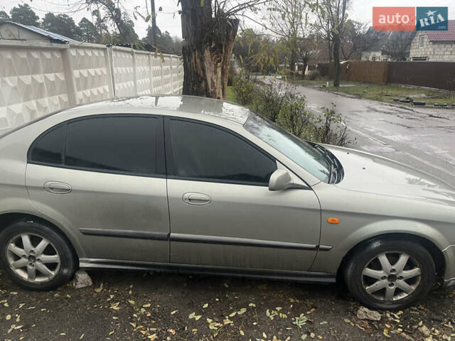 Серый Шевроле Эванда, объемом двигателя 2 л и пробегом 300 тыс. км за 3200 $, фото 2 на Automoto.ua