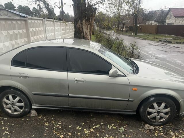 Сірий Шевроле Еванда, об'ємом двигуна 2 л та пробігом 300 тис. км за 3200 $, фото 2 на Automoto.ua