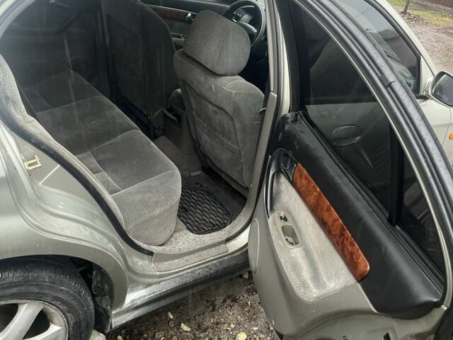 Сірий Шевроле Еванда, об'ємом двигуна 2 л та пробігом 300 тис. км за 3200 $, фото 8 на Automoto.ua