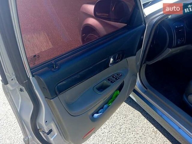 Сірий Шевроле Еванда, об'ємом двигуна 2 л та пробігом 288 тис. км за 3400 $, фото 6 на Automoto.ua