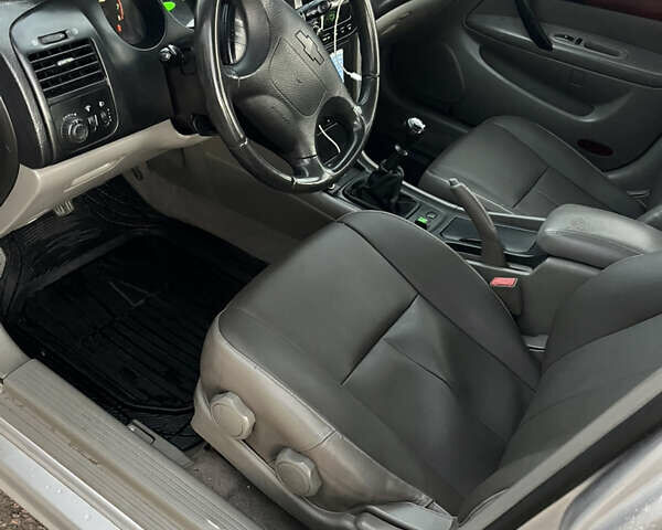 Серый Шевроле Эванда, объемом двигателя 2 л и пробегом 260 тыс. км за 3799 $, фото 6 на Automoto.ua