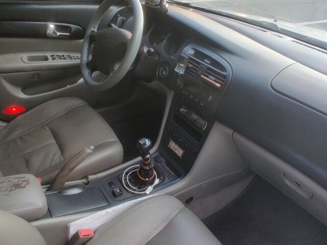 Сірий Шевроле Еванда, об'ємом двигуна 2 л та пробігом 219 тис. км за 3999 $, фото 12 на Automoto.ua