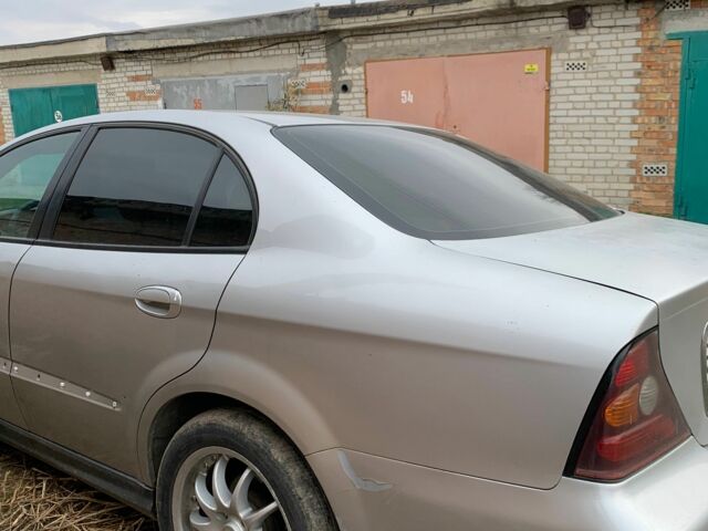 Серый Шевроле Эванда, объемом двигателя 2.5 л и пробегом 310 тыс. км за 2100 $, фото 2 на Automoto.ua