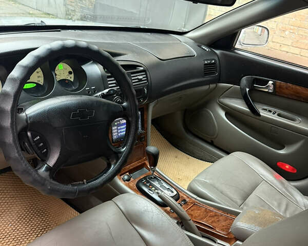 Сірий Шевроле Еванда, об'ємом двигуна 2.49 л та пробігом 299 тис. км за 3400 $, фото 12 на Automoto.ua