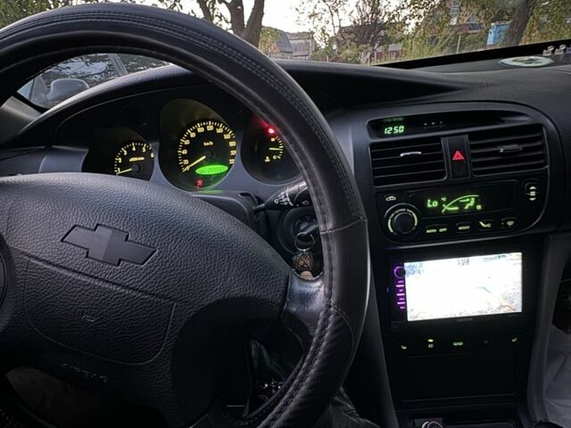 Серый Шевроле Эванда, объемом двигателя 2 л и пробегом 209 тыс. км за 3200 $, фото 7 на Automoto.ua