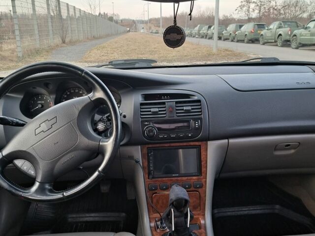 Синий Шевроле Эванда, объемом двигателя 2 л и пробегом 297 тыс. км за 4799 $, фото 2 на Automoto.ua