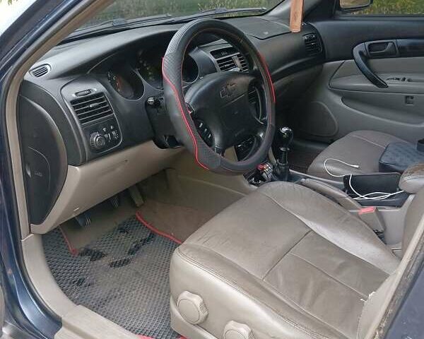 Синий Шевроле Эванда, объемом двигателя 2 л и пробегом 190 тыс. км за 3700 $, фото 5 на Automoto.ua