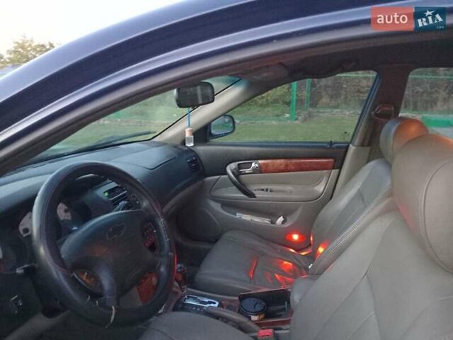 Синий Шевроле Эванда, объемом двигателя 2 л и пробегом 265 тыс. км за 3000 $, фото 6 на Automoto.ua