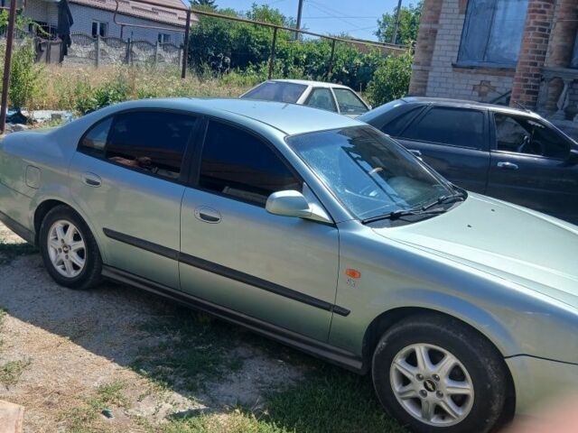 Зелений Шевроле Еванда, об'ємом двигуна 2 л та пробігом 330 тис. км за 3600 $, фото 6 на Automoto.ua