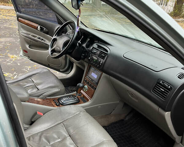 Зелений Шевроле Еванда, об'ємом двигуна 2 л та пробігом 242 тис. км за 1299 $, фото 7 на Automoto.ua