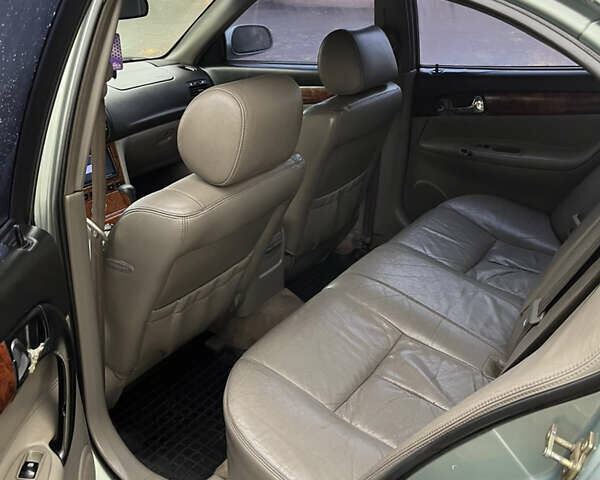 Зелений Шевроле Еванда, об'ємом двигуна 2 л та пробігом 242 тис. км за 1299 $, фото 5 на Automoto.ua