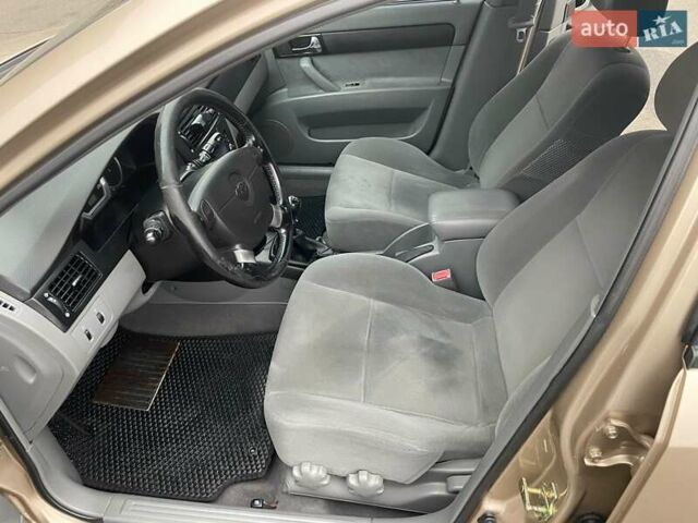 Бежевий Шевроле Лачетті, об'ємом двигуна 1.8 л та пробігом 212 тис. км за 4200 $, фото 9 на Automoto.ua