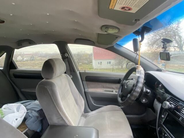 Черный Шевроле Лачетти, объемом двигателя 1.6 л и пробегом 250 тыс. км за 2600 $, фото 4 на Automoto.ua