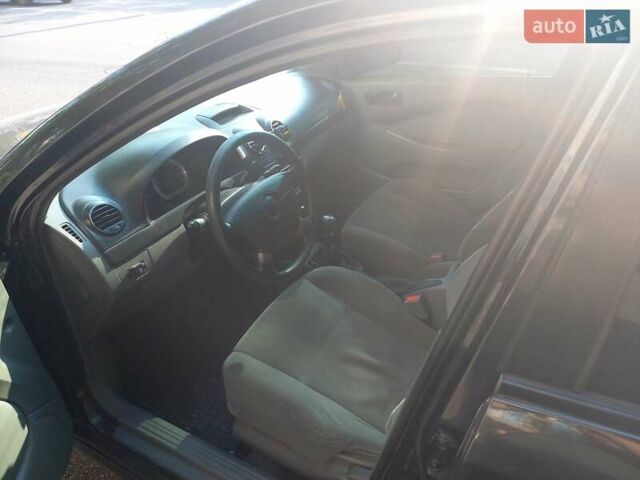 Черный Шевроле Лачетти, объемом двигателя 1.6 л и пробегом 284 тыс. км за 3700 $, фото 4 на Automoto.ua