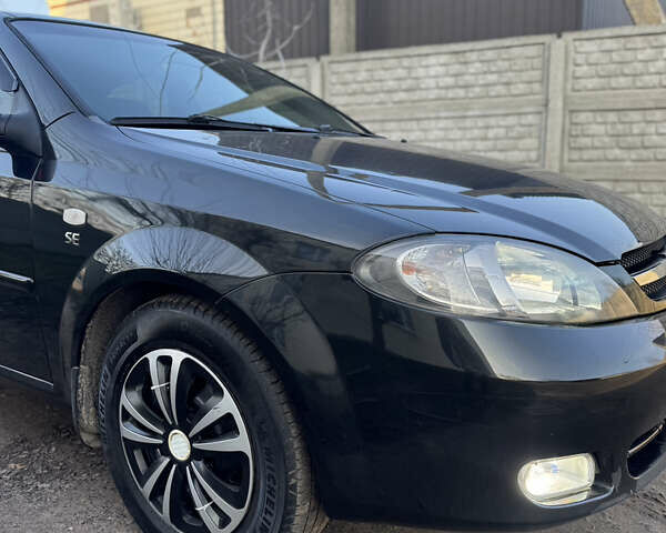 Черный Шевроле Лачетти, объемом двигателя 1.6 л и пробегом 209 тыс. км за 3850 $, фото 12 на Automoto.ua