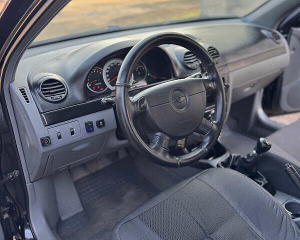 Черный Шевроле Лачетти, объемом двигателя 1.6 л и пробегом 209 тыс. км за 3850 $, фото 15 на Automoto.ua